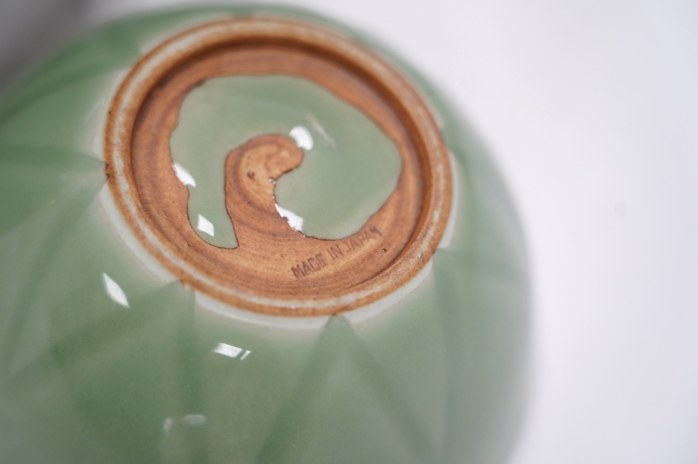 Four items of Chinese celadon porcelain and a similar pair of vases, tallest 19.5cm high. Condition - bottle vase and small pottery vase chipped, the others good
